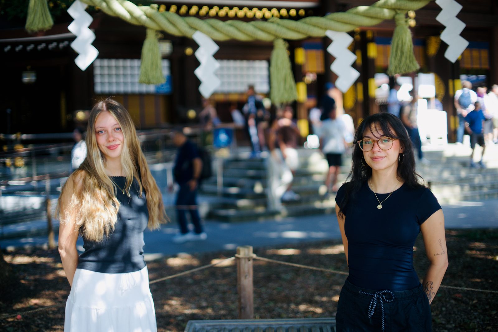 Two sisters in the courtyard of Meiji Jingu